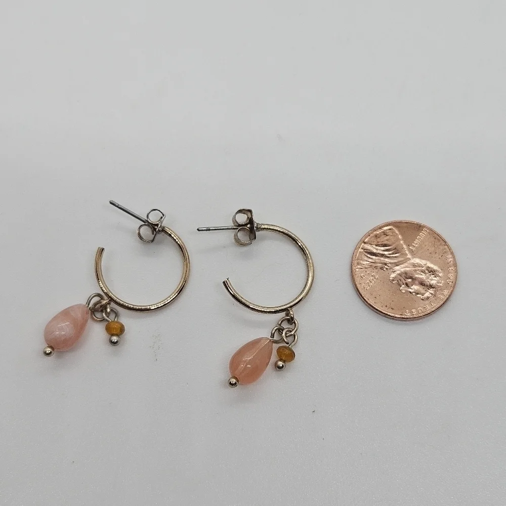 small gold tone hoop earrings with pink and orange beads